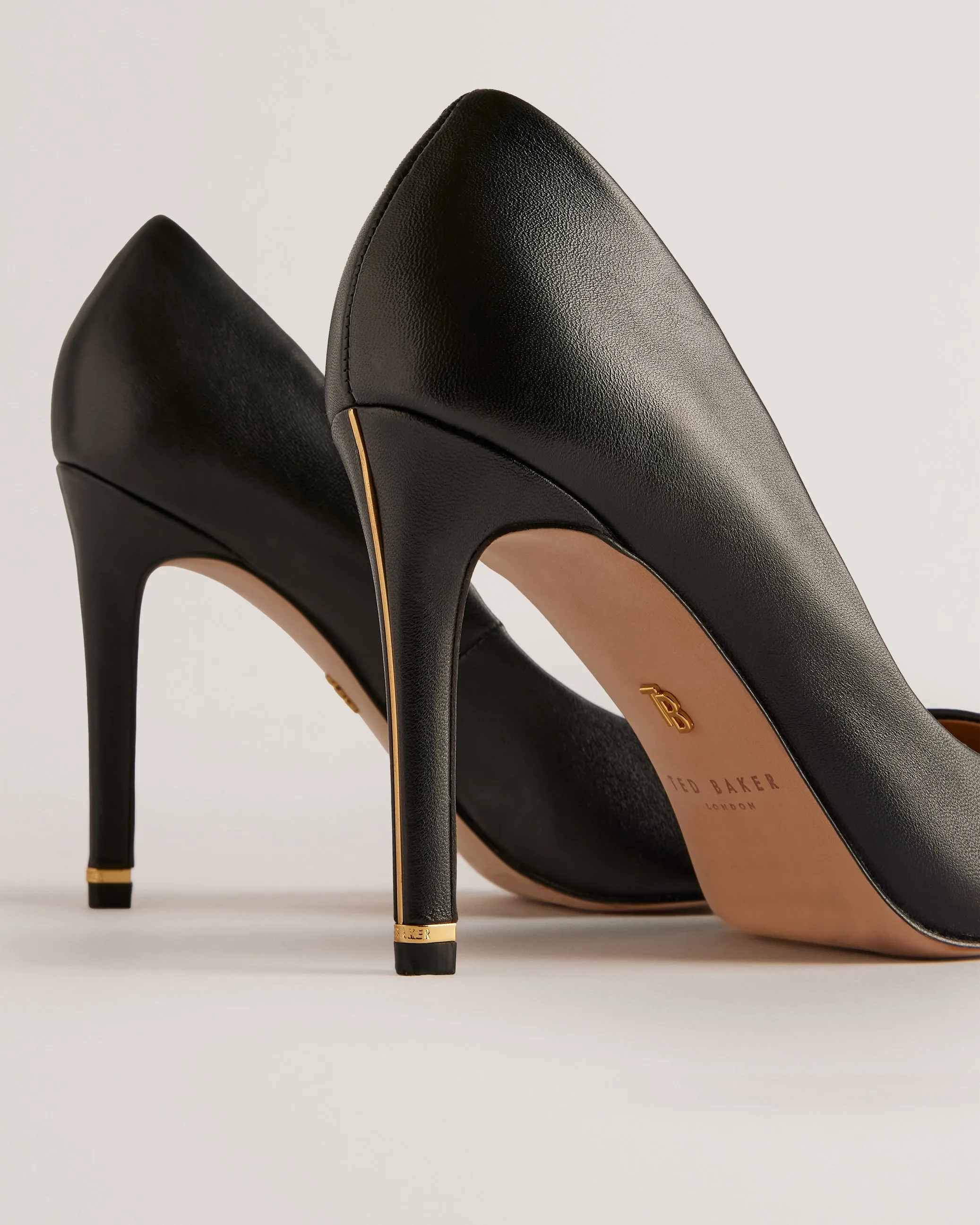 Caaraa High-Heeled Pump With River Of Gold Heel Black